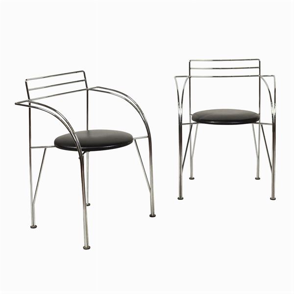 Pair of chairs with armrests