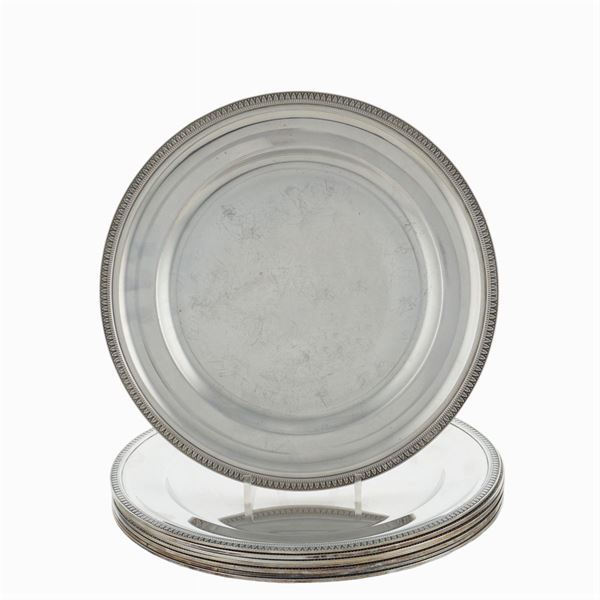 Eight silver under plates