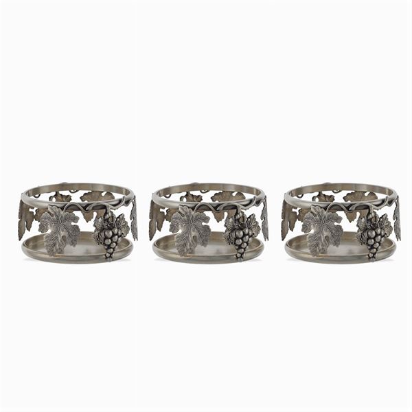 Three silver plated metal bottle coasters