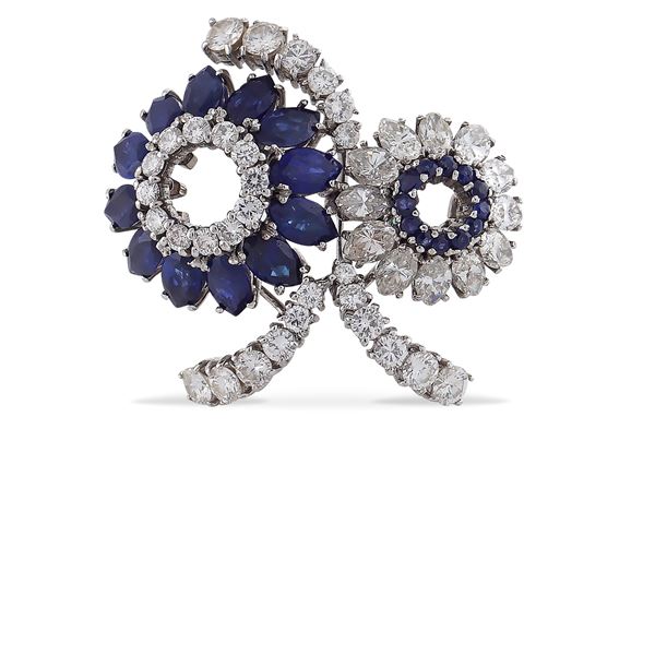 Platinum floral pattern brooch with diamonds and sapphires