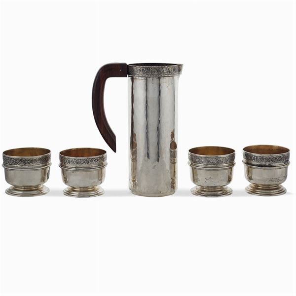 Silver pitcher and four cups