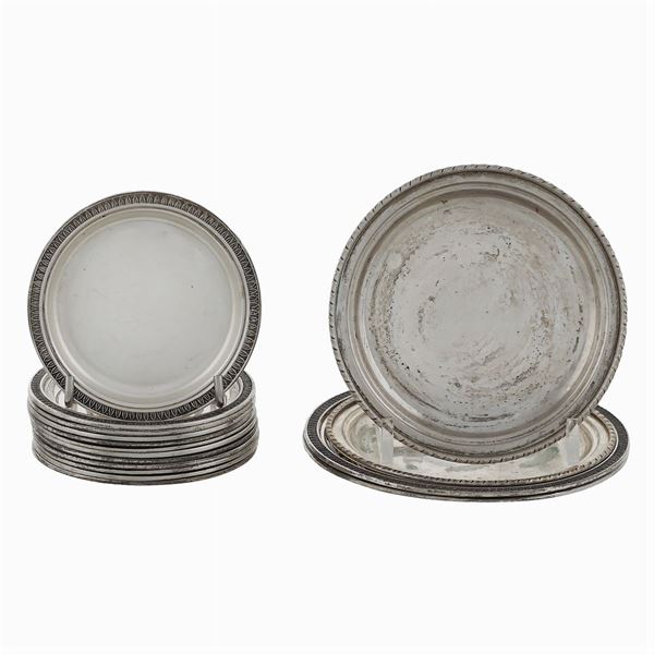 Sixteen small silver plates