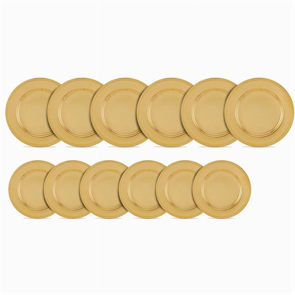Servizio di 24 piatti in argento vermeil