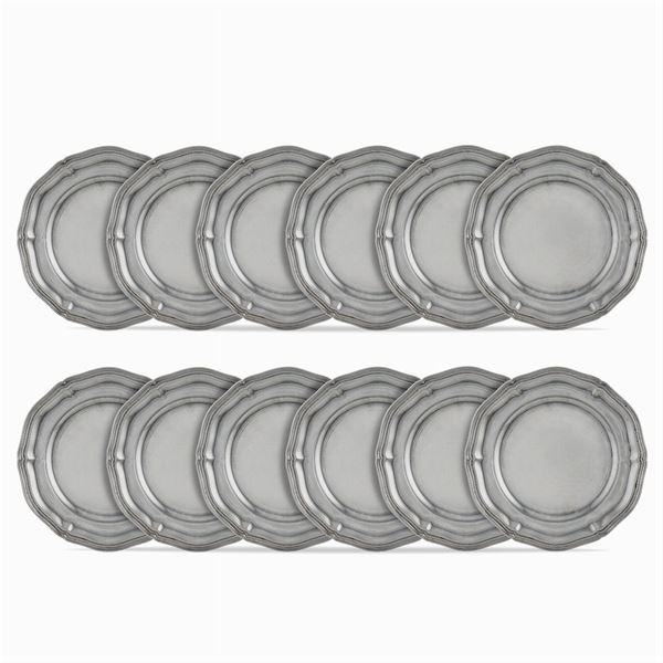 Twelve silver under plates