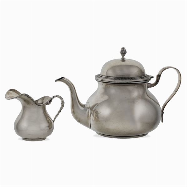 Silver tea pot and milk jug