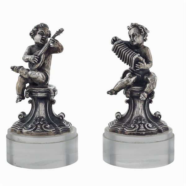 Pair of small silver sculptures