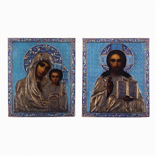 Pair of icons in partially gilded silver and polychrome enamels