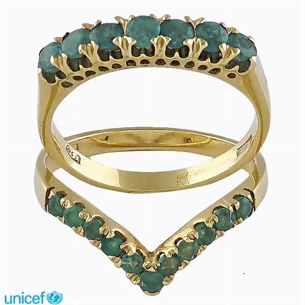 Two 18kt and emerald en suite rings