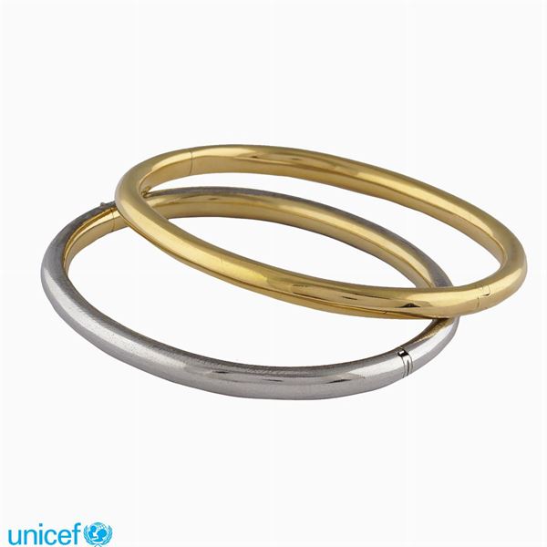 Due bracciali in oro giallo e bianco 18kt