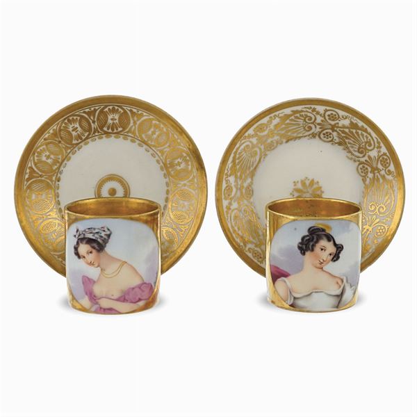 Two polychrome porcelain cups with saucers