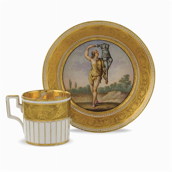 Polychrome and golden porcelain cup with saucer
