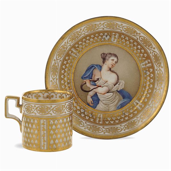 Polychrome and golden porcelain cup with saucer