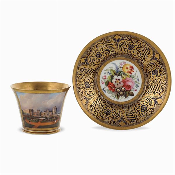 Polychrome and gilt porcelain cup with saucer