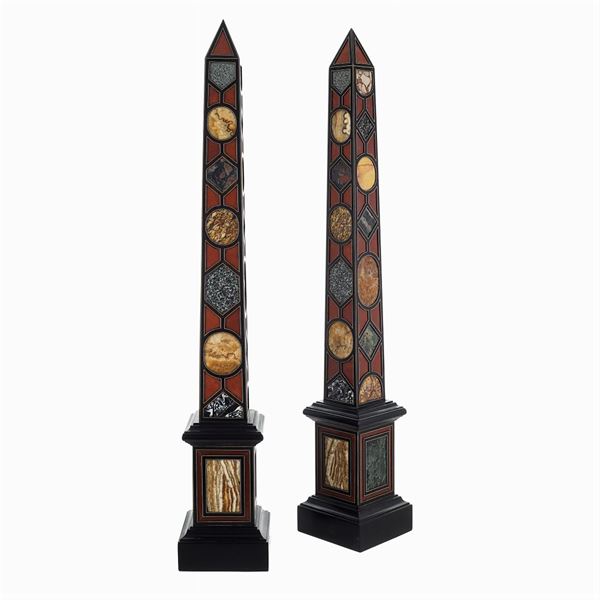 Pair of ebonized wooden and marble obelisks