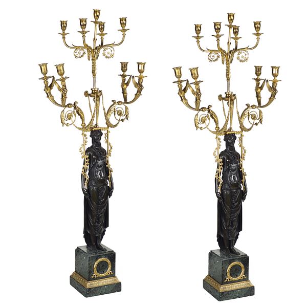 Importante coppia di candelabri a nove luci in bronzo dorato e brunito