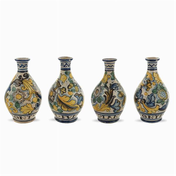 Four majolica chemist jugs
