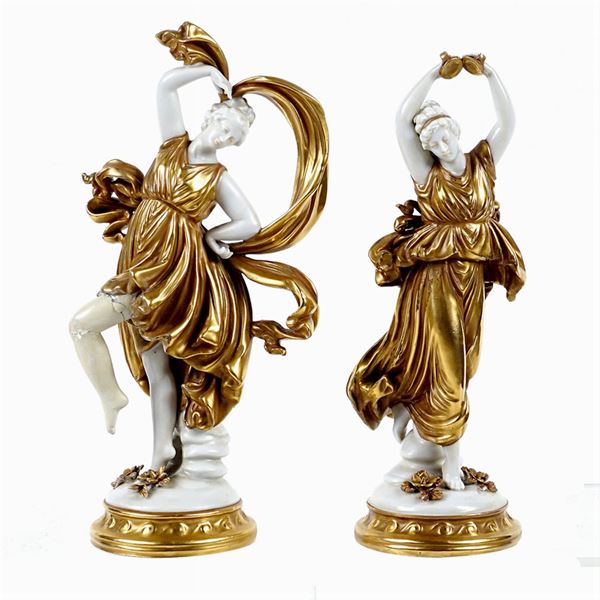 Pair of white and golden porcelain figures