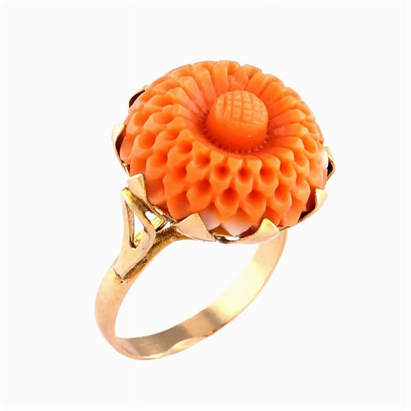 An 18kt gold and mediterranean coral ring