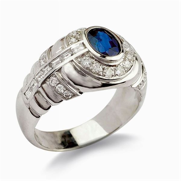 Anello in oro bianco 18kt con zaffiro ovale e diamanti