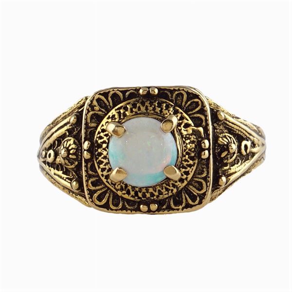 A 14kt gold and multi-color opal ring