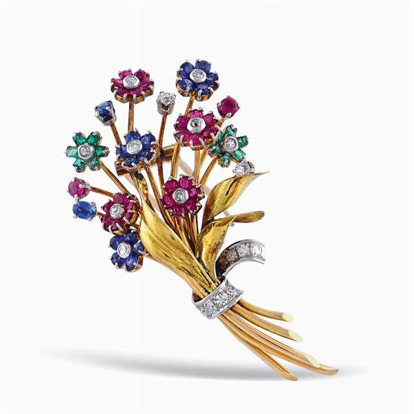 Spilla a motivo floreale in oro a due colori 18kt