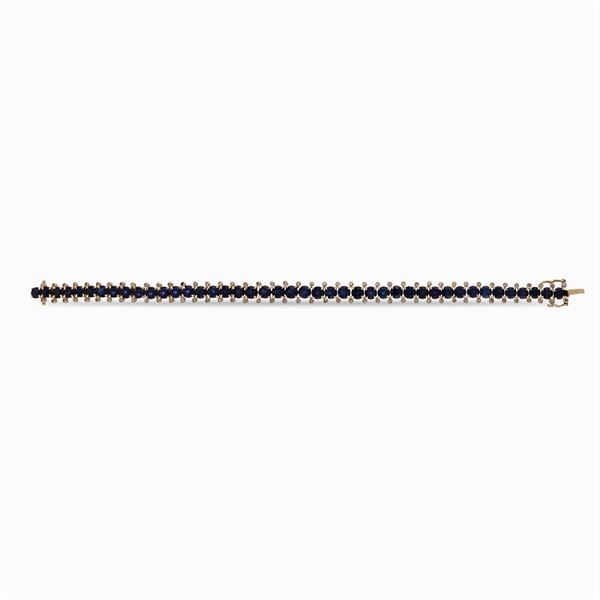 Bracciale tennis in oro giallo 18kt e zaffiri tondi