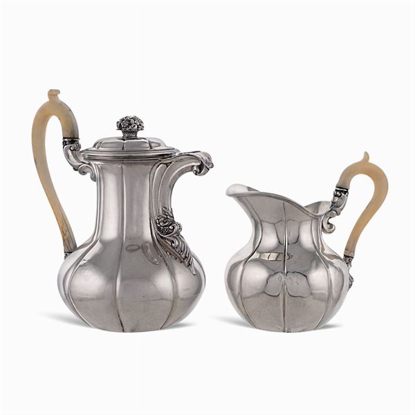 Silver teapot and milk jug