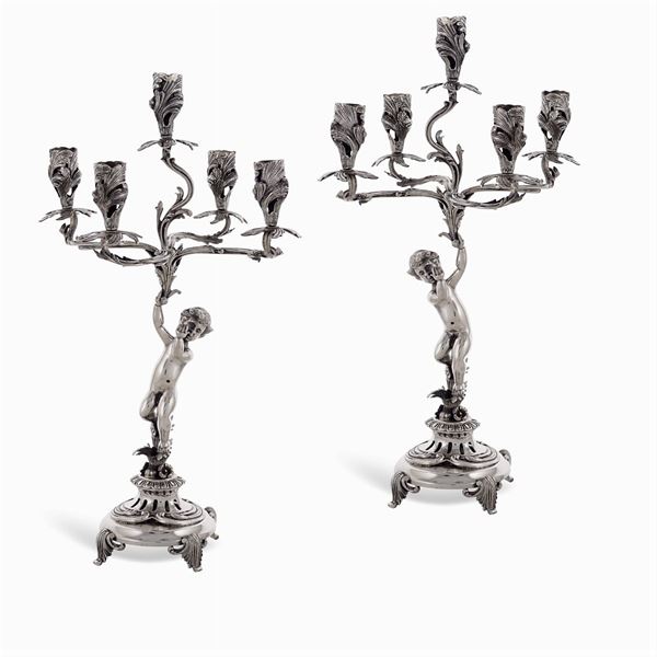 Coppia di candelabri in argento a cinque luci