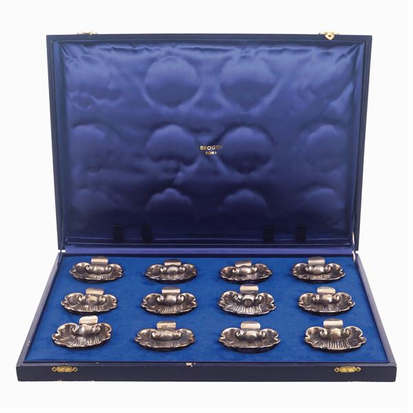 Set di dodici segnaposto in argento