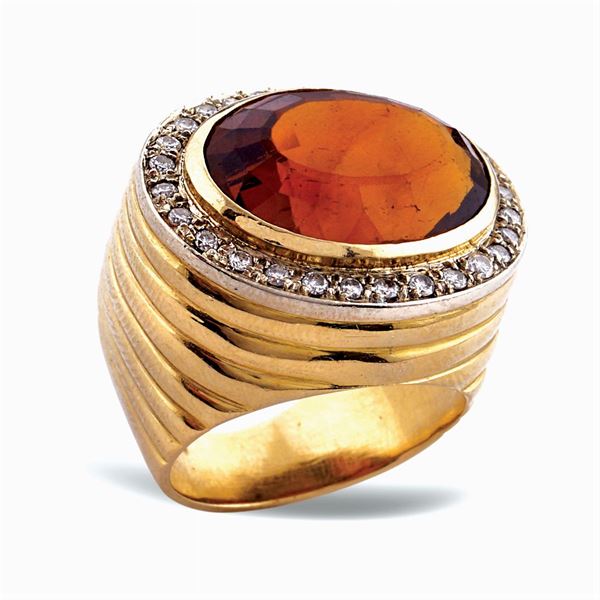 Anello in oro giallo 18kt e topazio giallo