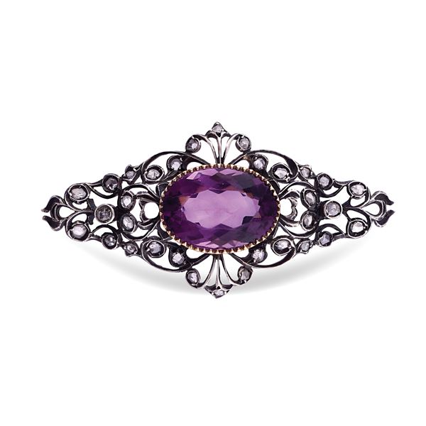 Silver and gold brooch with amethyst