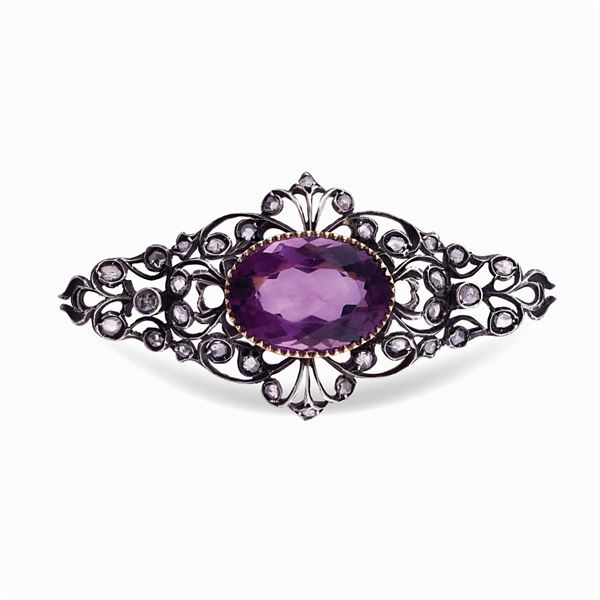 Silver and gold brooch with amethyst