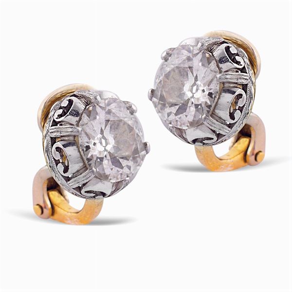 Gold and silver earrings with two diamonds