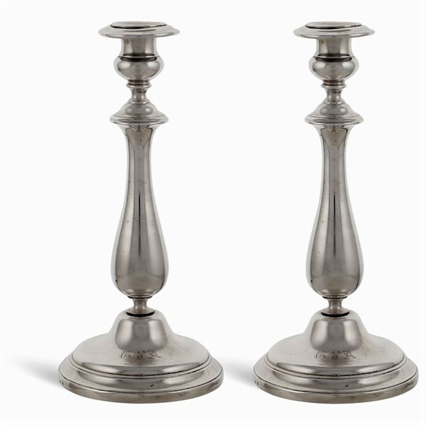 Two silvered metal candleholders