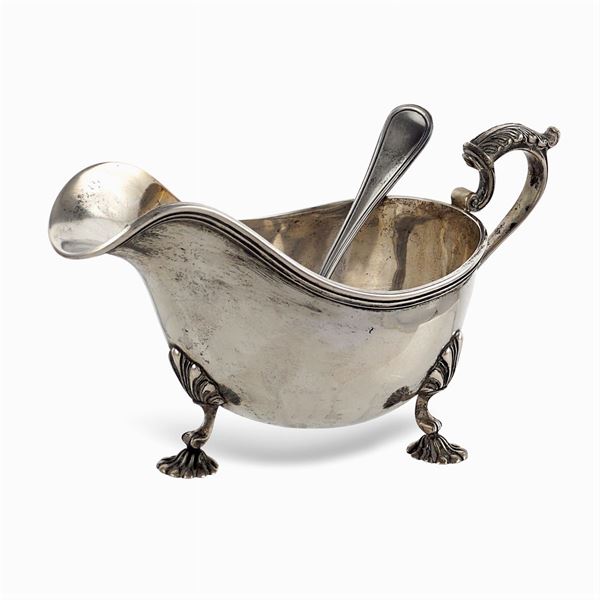 Silver sauceboat with strainer
