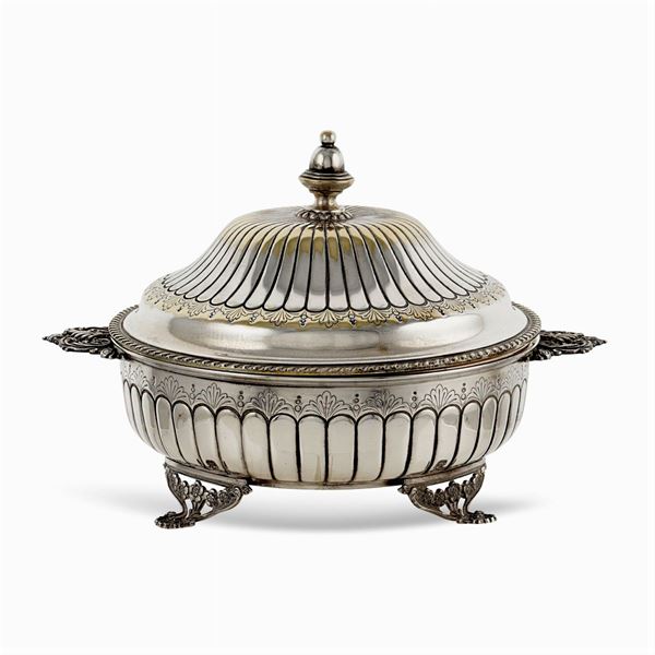 Circular silvered metal entree dish