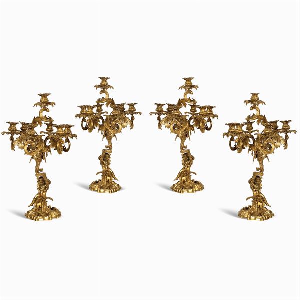 Quattro candelabri a sette luci in bronzo dorato