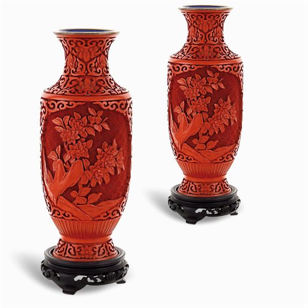 A pair of red varnish vases