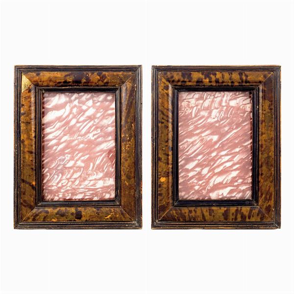 a pair of wooden and tortoise shell frames
