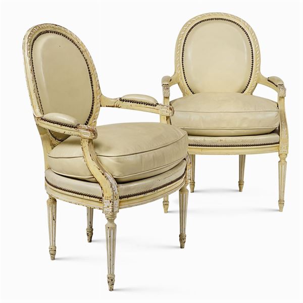 A pair of armchairs in lacquered wood "Louis XVI"