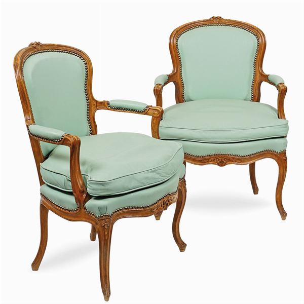 a pair of beechwood Louis XV armchairs