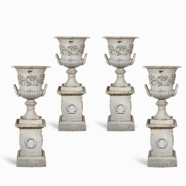 Four Medicean cast iron vases