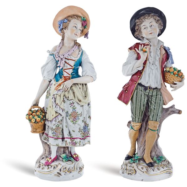 a pair of policrome ceramic figures