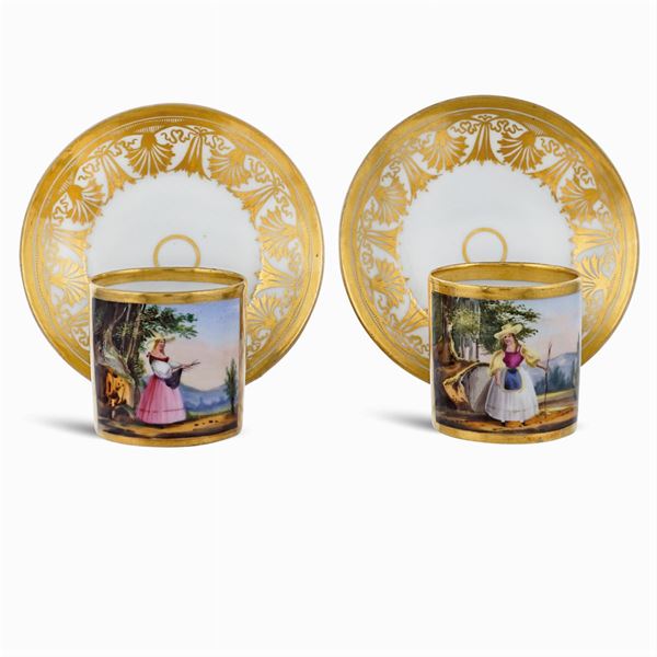 A pair of porcelain cups with saucer