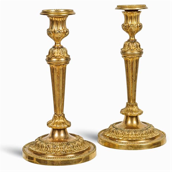 A pair of gilt bronze candelabra