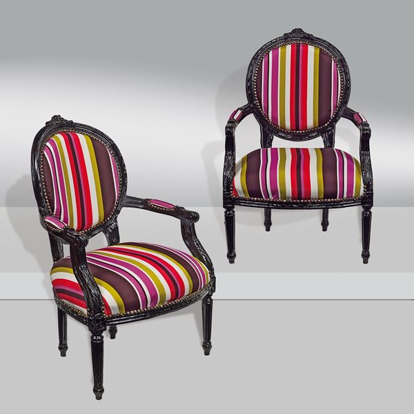 A pair of multicolour wood armchairs