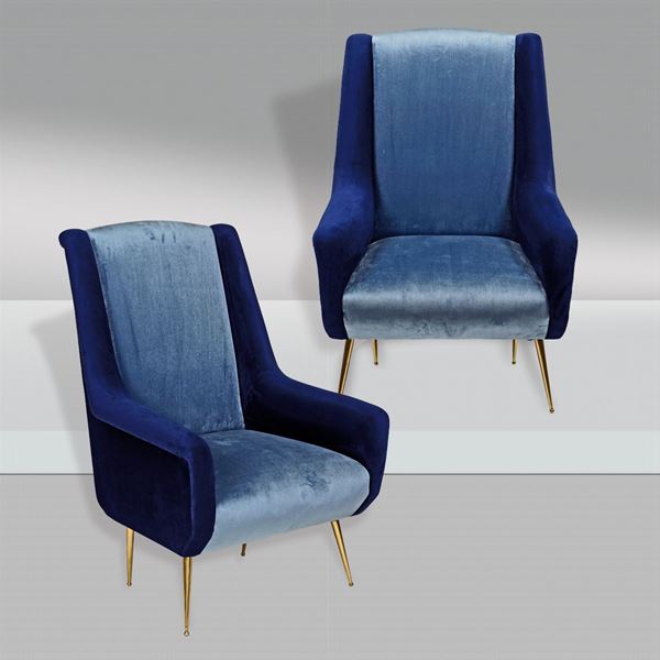 A pair of velvet armchairs