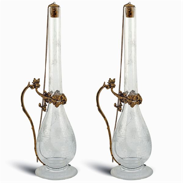 A pair of glass and vermeil silver bottles