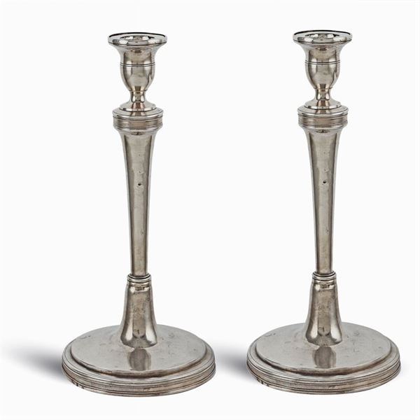 A pair of silver candelabra