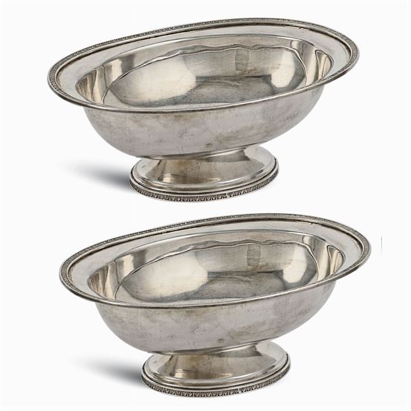A pair of silver sauceboats